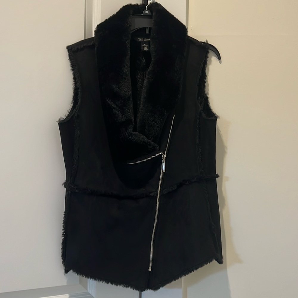 White House Black Market, black faux fur vest.   Super soft with two pockets.
